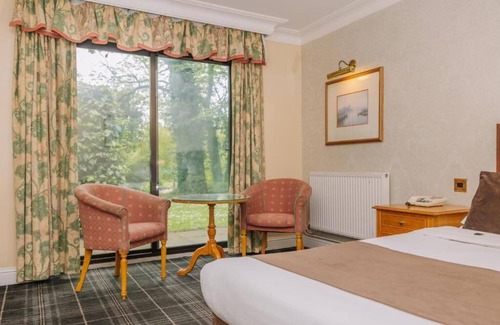 Ipswich Hotel | Historic Charm Meets Relaxation | Daily Breakfast, Indoor Pool & Garden Serenity