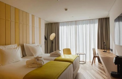 Sao Jorge de Arroios Hotel | Historic Lisbon at Your Door—Unwind in Pool Tranquility & Watch Light Show