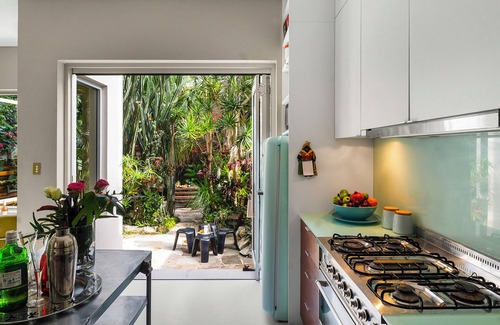 Redfern House | Historic sandstone home with designer interior & tropical garden. pets welcome!