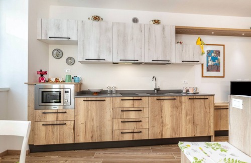 Levico Terme Apartment | Holiday Apartment 'L'Antica Corte Apt Elena' with Mountain View, Terrace & Wi-Fi