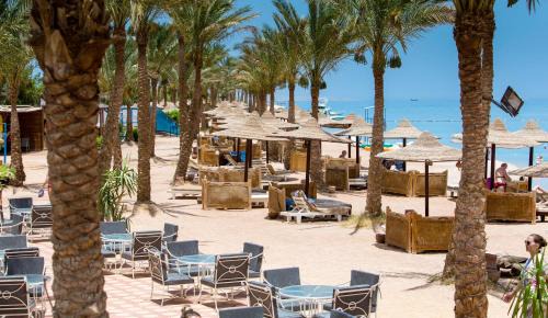 Village Road Resort | Hostgool Beach Chalets Mirage bay resort & aqua park