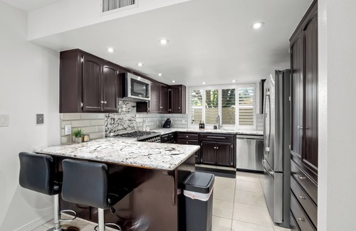 Fresno House | Hot Tub, Game Room - 3 Bed: 2 Bath near Fig Garden Loop!