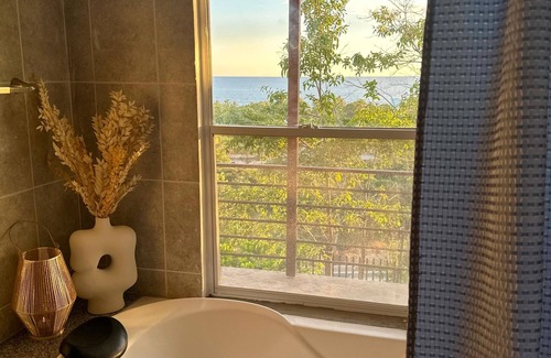 Santa Tecla House | house with a beautiful sea view in enchanting SurfCity with WiFi, AC and Pool.