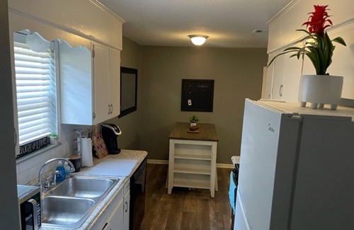 Conway House | House with fenced-in backyard near educational & medical institutions in Conway.