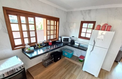 Mococa House | House with pool and barbecue in a closed condominium