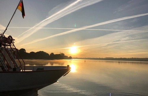 Schleswig Boat Rental | Houseboat Fjord anchorage with bio-sauna and roof terrace in Schleswig