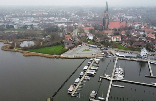 Schleswig Boat Rental | Houseboat Fjord anchorage with bio-sauna and roof terrace in Schleswig