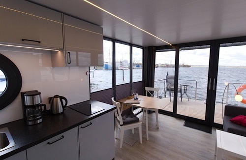 Wendtorf Boat Rental | Houseboat Fjord Auriga with bio sauna and roof terrace in Wendtorf/Kiel Fjord