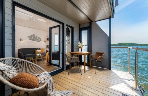 Schleswig Boat Rental | Houseboat moments of happiness for 4 people with roof terrace on the Baltic Sea fjord Schlei