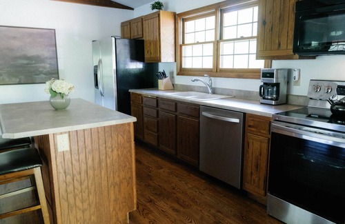 Logan Ski Chalet | Houston Lodge, 5BR Lodge with a large covered porch and a great view
