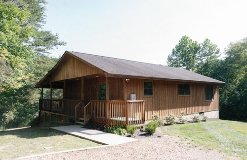 Logan Ski Chalet | Houston Lodge, 5BR Lodge with a large covered porch and a great view