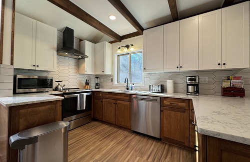 Bushkill House | Huge 3000sqf Creek Front - 8 person hot tub, Fire pit, two decks, Ski Hill.