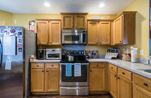 Mount Mourne House | Hummingbird Manor - Relax in Hot Tub in Private Backyard with fire pit area