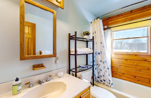 Meredith House | Idyllic lake retreat with beach access, firepit, wraparound porch, & great views