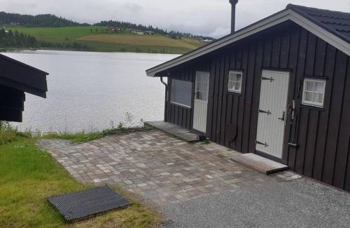 Orkdal House | Idyllic lakeside cabin with private beach and boat