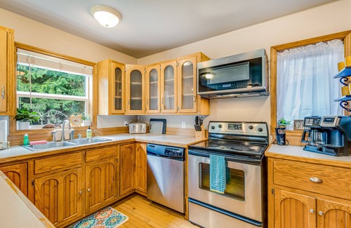 Camano Island House | Idyllic woodsy retreat with firepit, two kitchens, Port Susan views & woodstoves