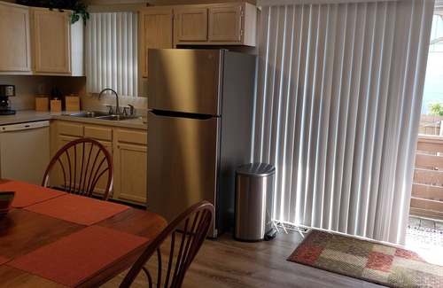 Heron Harbour Isle House | Immaculate townhome with private fenced back patio. 9.98 star rating.