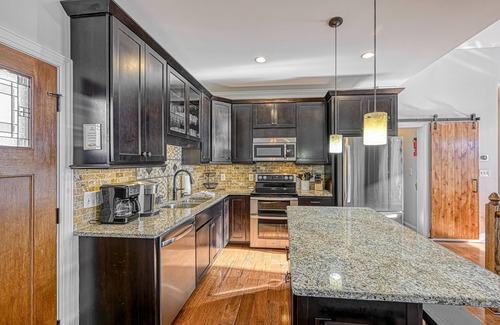 Livingston House | Impressive lakefront home with private dock, 2 boat slips, firepit, deck, grill