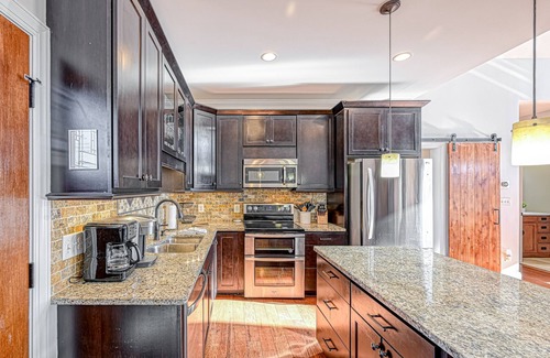 Livingston House | Impressive lakefront home with private dock, 2 boat slips, firepit, deck, grill