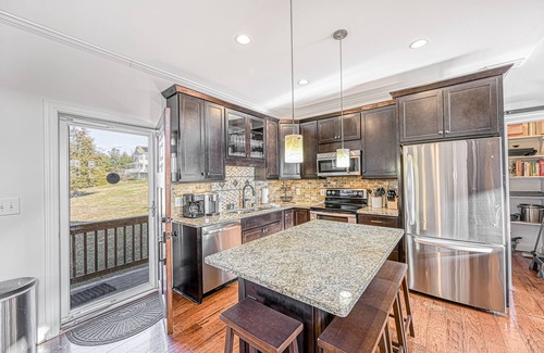 Livingston House | Impressive lakefront home with private dock, 2 boat slips, firepit, deck, grill