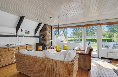 Østerskov House | In Bukkemose you will find this beautiful vacation home made of stone and wood.