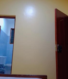 Manyimbo House | Indian ocean apartments you get the master bedroom with the private bathroom and the host sleeps in the other bedroom you share kitchen anc living room