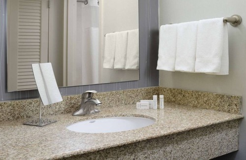 North Dallas Hotel | Indulge in Home-Like Comfort! Outdoor Pool, Pet-friendly and Parking!