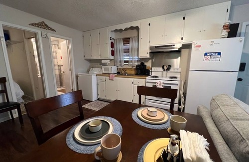 Lake Charles House | Indulge in stunning vistas from the porch, complemented by essential amenities for a cozy