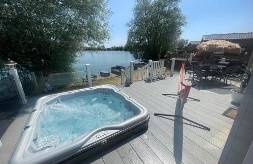 Tattershall House | Indulgence lakeside lodge i1 with hot tub, private fishing peg situated at Tattershall Lakes Country Park