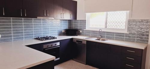 Rockingham Apartment | Inviting Stay Close to Rockingham and Palm Beach - Hosted by Canstay