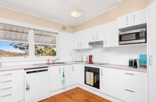 Shoal Bay Cottage | Jen's Place. a charming vintage cottage that embodies the essence of classic coastal living.