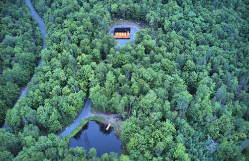 Lac-Superieur Ski Chalet | KALLM-Mont-Tremblant chalet with hot tub, pond & beach on private 7acre estate