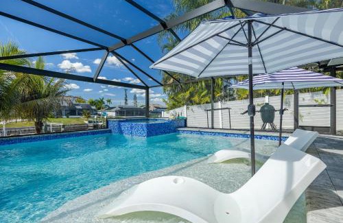 Cape Coral House | Kayaks, Boat Dock, Heated Pool & Spa, Outside Kitchen, Tiki Hut - Villa Pedro - Roelens Vacations