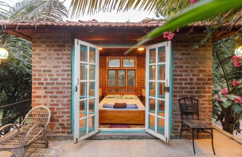 Bengaluru House | Kerala Style Villa by JadeCapsAC4BHKFishpond