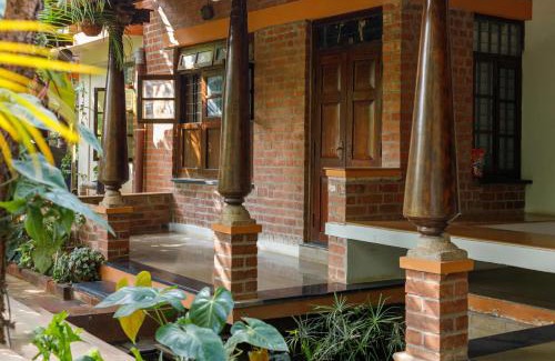 Bengaluru House | Kerala Style Villa by JadeCapsAC4BHKFishpond