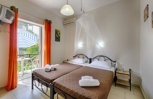Agios Georgios Pagon Apartment | Kostas Studio 1 - the beach, small supermarkets and restaurants are within easy walking distance