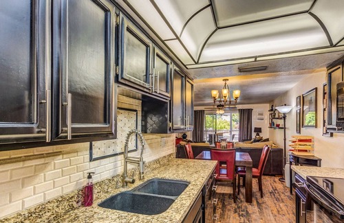 Desert Shores Condo | Lake Front Balcony! Quiet community! Walking path! Restaurants! Heated Pool