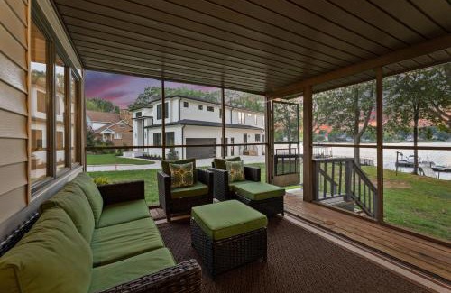 Mayhew House | Lake Norman Waterfront Home w Covered Porch Sunset Views Easy Access to Dining Shopping Uptown Charlotte Adventures Sunsets on Shoreline