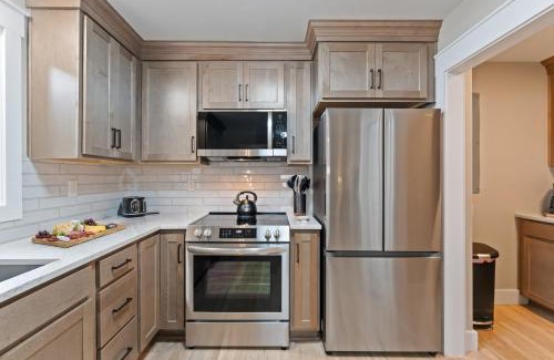 Mayhew House | Lake Norman Waterfront Home w Covered Porch Sunset Views Easy Access to Dining Shopping Uptown Charlotte Adventures Sunsets on Shoreline