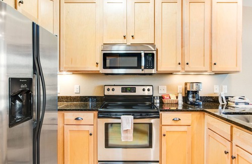 Three Lakes Condo | Lake-view condo with balcony, gas fireplace, indoor pool, hot tubs, & gym