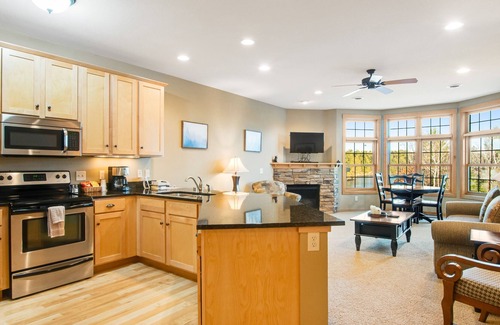 Three Lakes Condo | Lake-view condo with balcony, gas fireplace, indoor pool, hot tubs, & gym