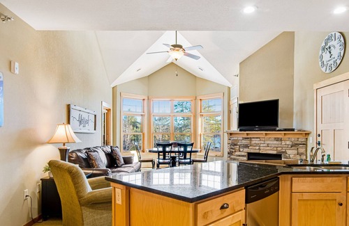 Three Lakes Condo | Lake-view condo with pool and hot tub access, jetted tub, firepit, and a balcony