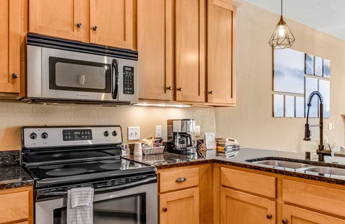 Three Lakes Condo | Lake-view condo with patio, fireplace, hot tubs, pools, firepit, gym, golf & W/D