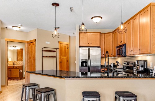 Three Lakes Condo | Lake-view condo with patio, fireplace, hot tubs, pools, firepit, gym, golf & W/D