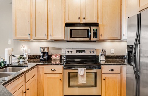 Three Lakes Condo | Lake-view condo with fireplace, loft, washer/dryer, pools, hot tubs, & firepit