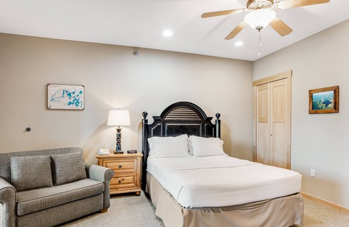 Three Lakes Condo | Lake-view condo with fireplace, loft, washer/dryer, pools, hot tubs, & firepit