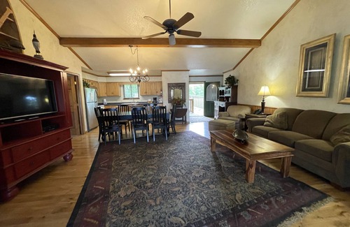 Mount Ida Cottage | Lake view three bedroom, three bath log-sided cottage with private hot tub overlooking Lake Ouachita. by RedAwning