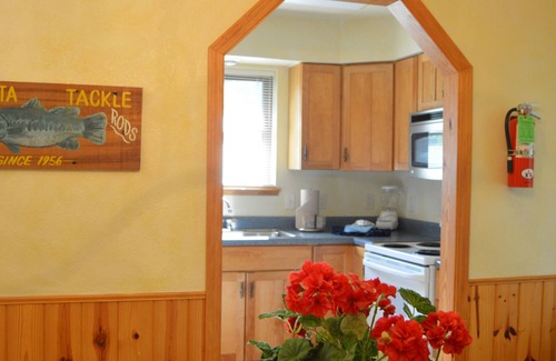 Mount Ida Cottage | Lake view two bedroom, two bath log-sided, luxury Harbor North loft cottage with hot tub overlooking Lake Ouachita. by RedAwning