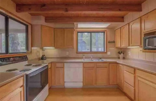 Wright City Ski Chalet | Lakefront cabin with canoes, fishing, fire pit, and ping pong