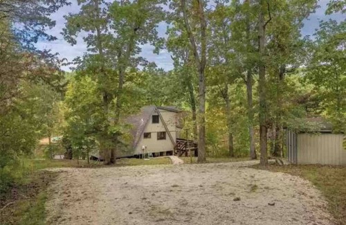 Wright City Ski Chalet | Lakefront cabin with canoes, fishing, fire pit, and ping pong